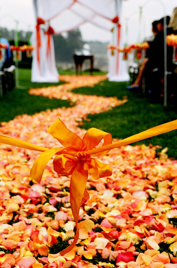 orange rose petal wedding aisle photo by Yvette Roman Photography